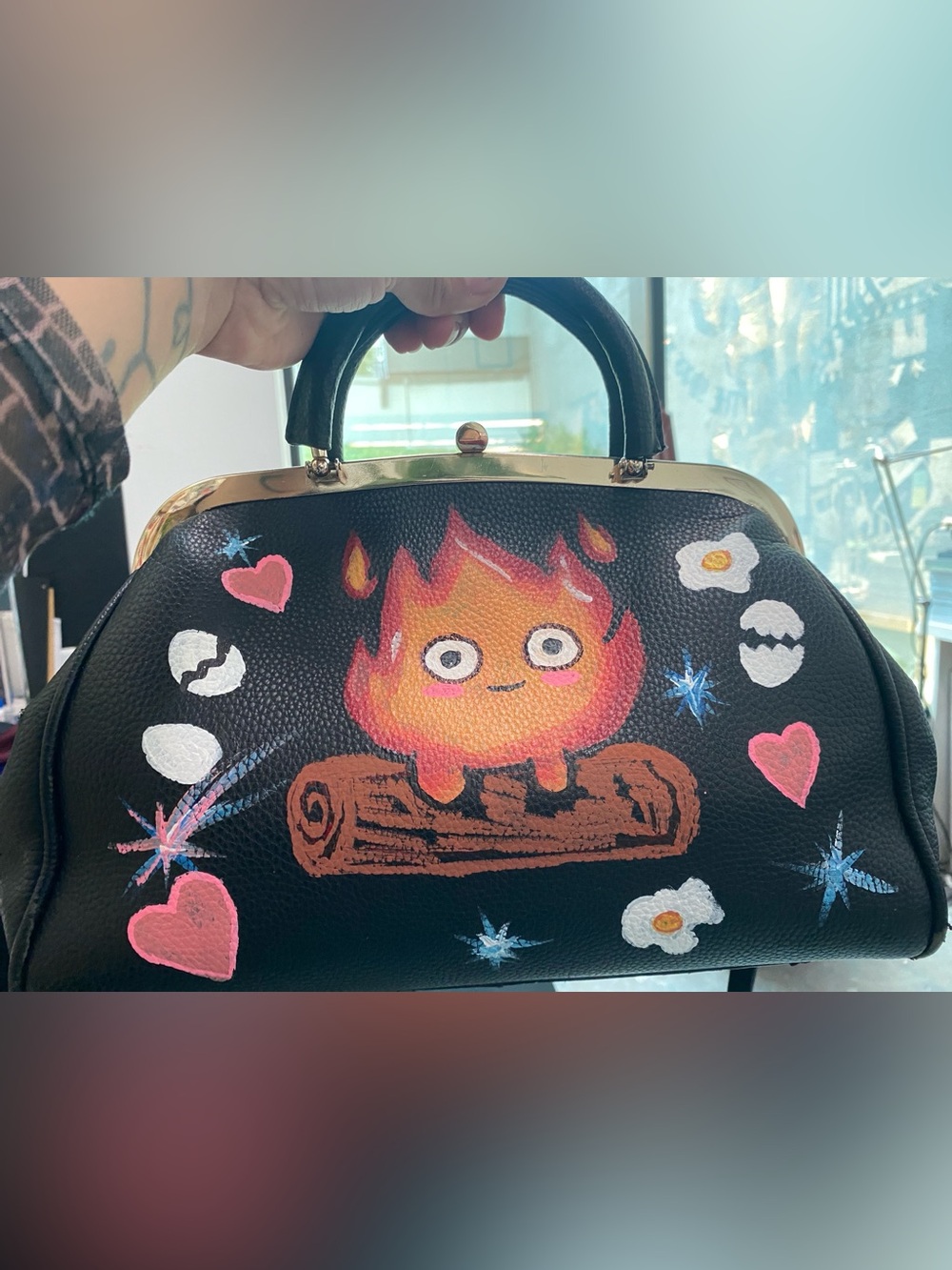 Hand painted flame character handbag, and soot characters.